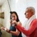 A senior man exercises with a personal trainer in the gym, promoting health and fitness., tags: brits - pexel
