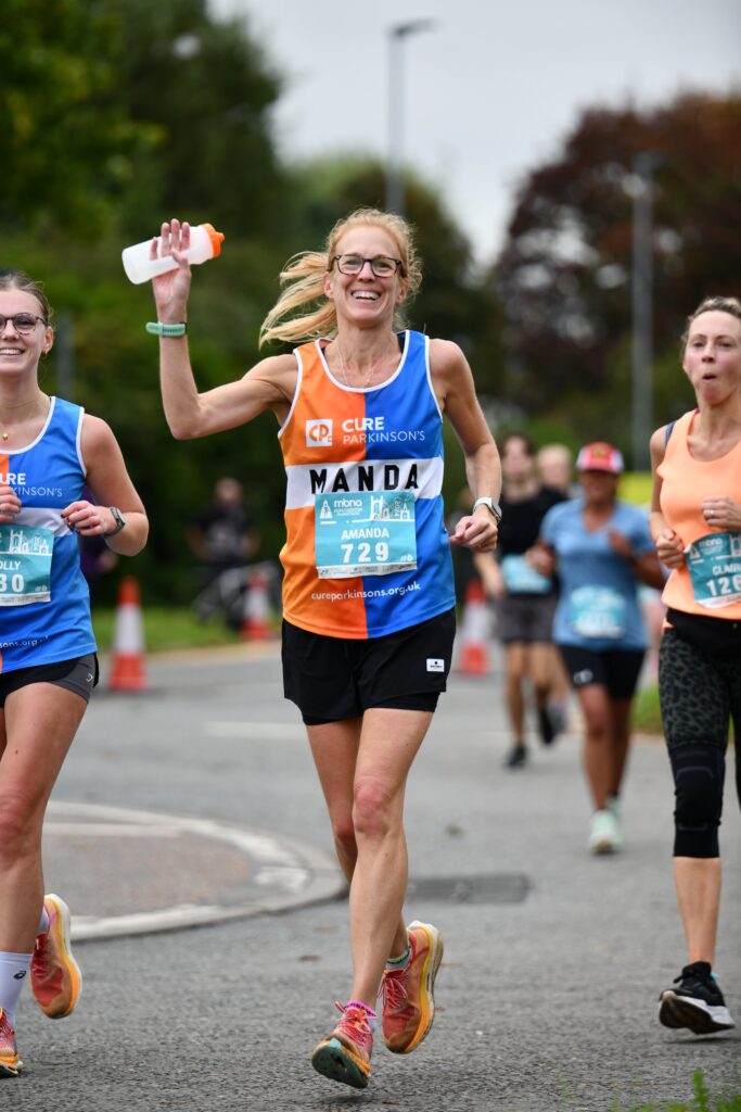 Young woman running marathon