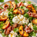 Burrata, grilled peach and prosciutto salad